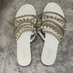 White spike sandals